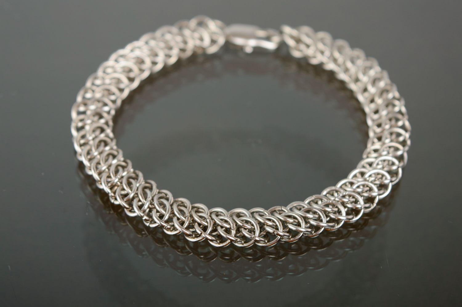 Handmade bracelet woven of jewelry alloy elements photo 1