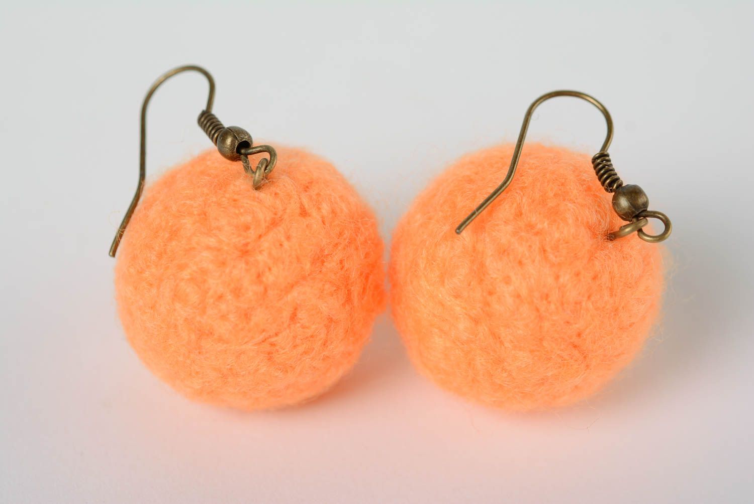 Handmade ball shaped dangling earrings felted of natural wool in peach color photo 1