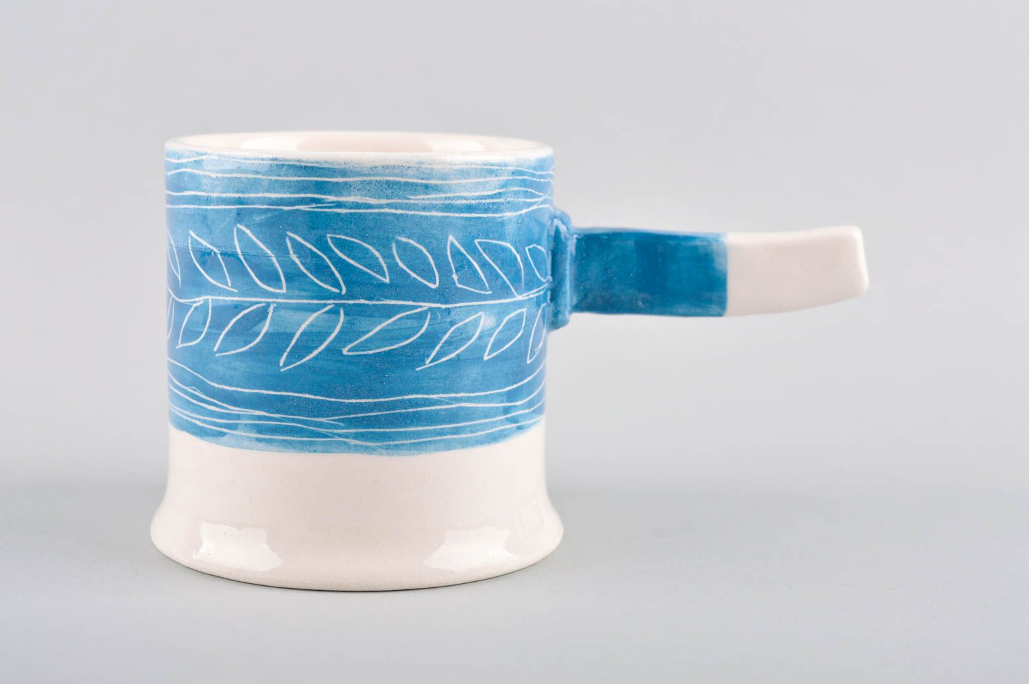 Art ceramic glazed white and blue coffee mug with stick shape handle photo 2