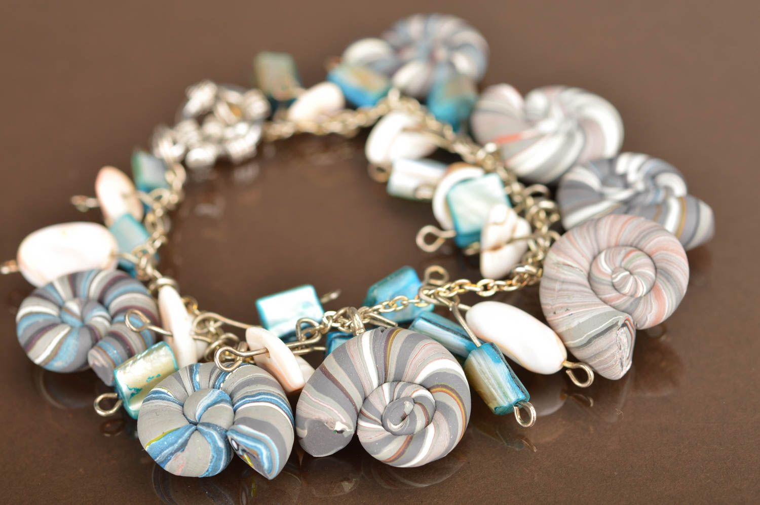Handmade bracelet made of polymer clay on chain decorated with striped shells photo 3