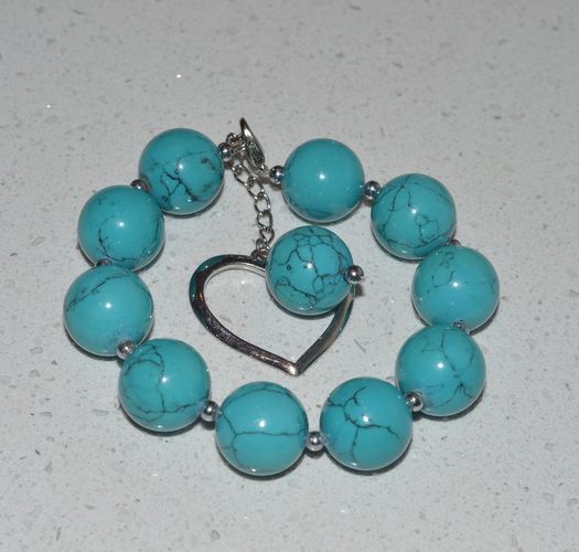 Wrist bracelet with round turquoise beads and charm photo 1