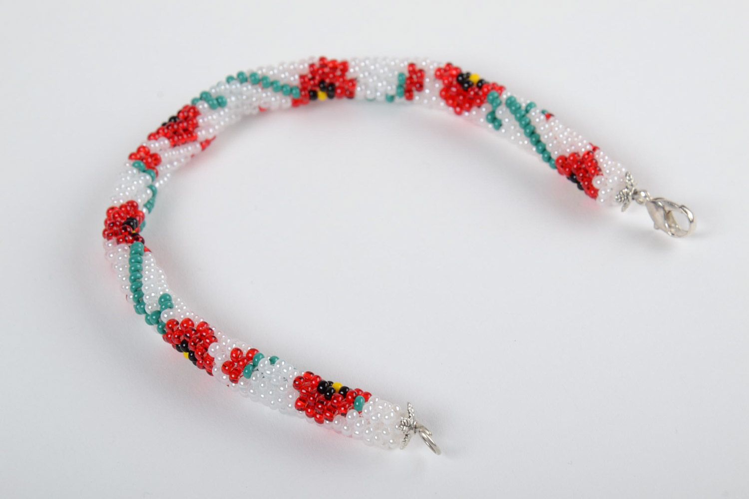 Festive white handmade beaded cord bracelet with floral motives photo 4