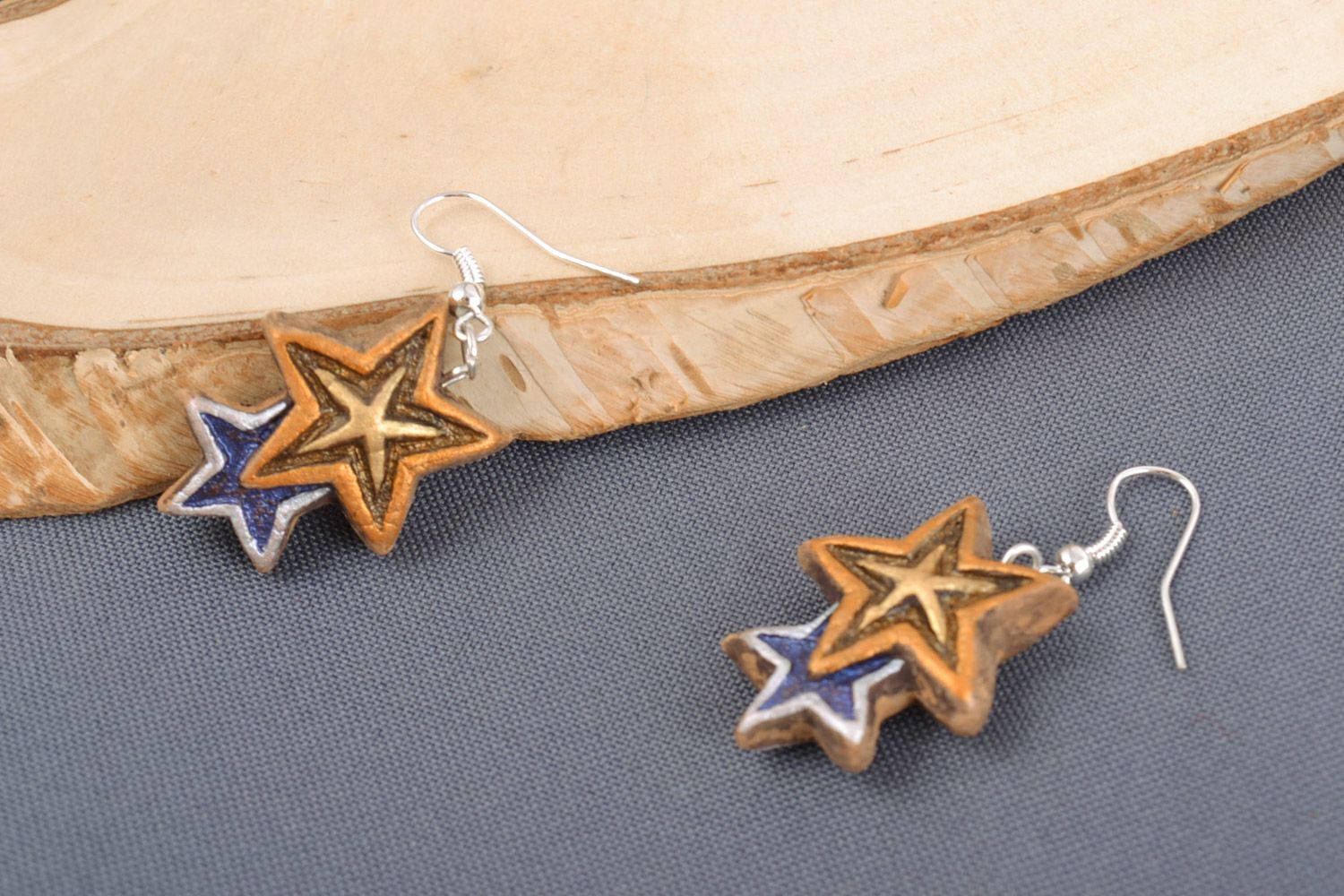 Handmade clay dangle earrings in the shape of stars with acrylic painting photo 1