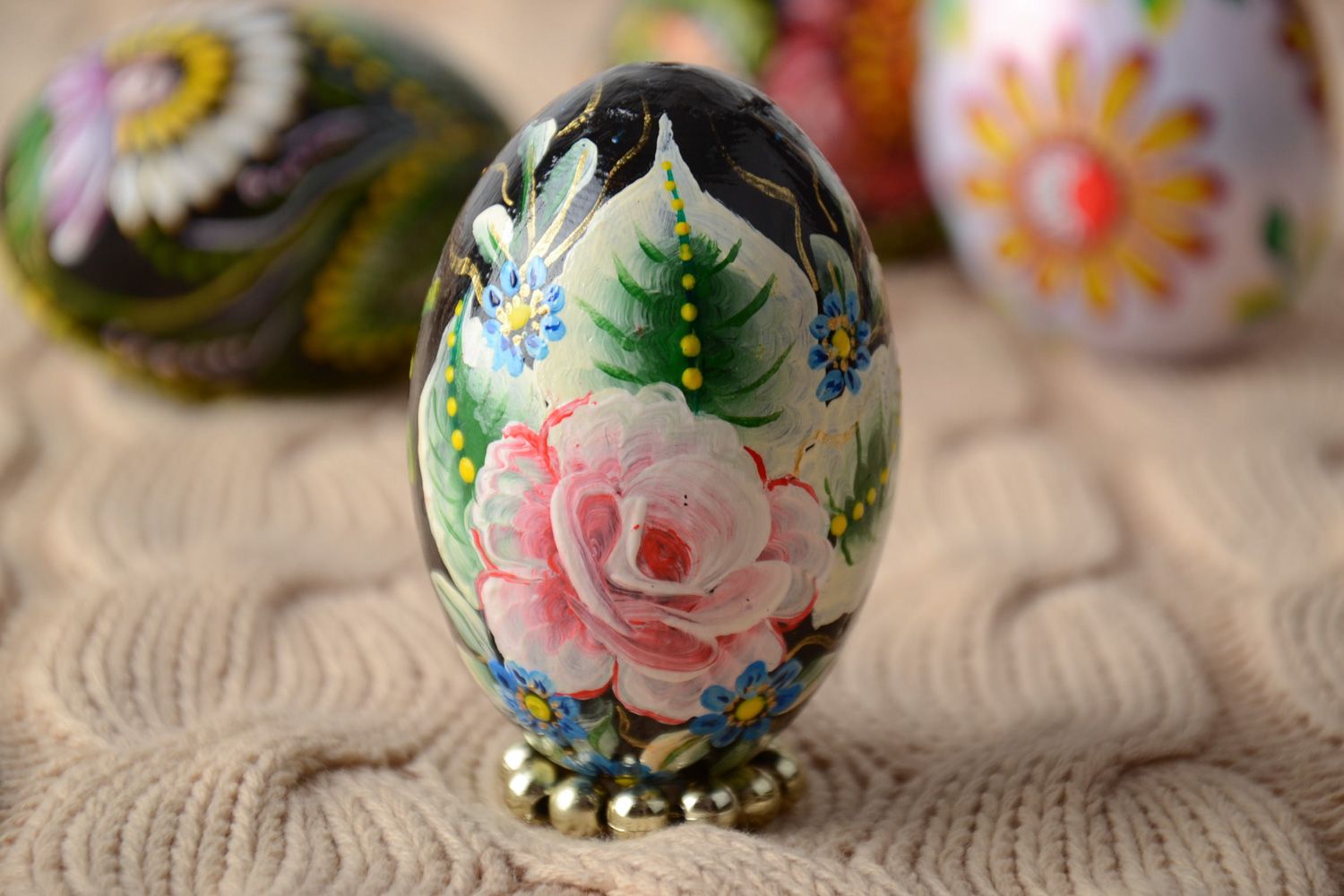Handmade carved wooden Easter egg decorated using one stroke painting technique photo 1