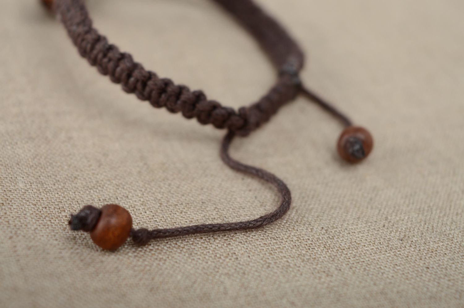 Unusual macrame bracelet of brown color with wooden beads photo 4