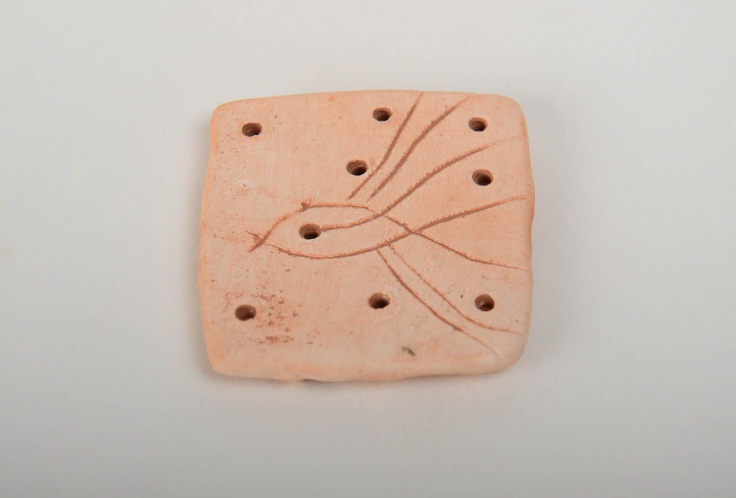 Handmade ceramic pendant of square shape molded of pottery clay with perforation photo 3