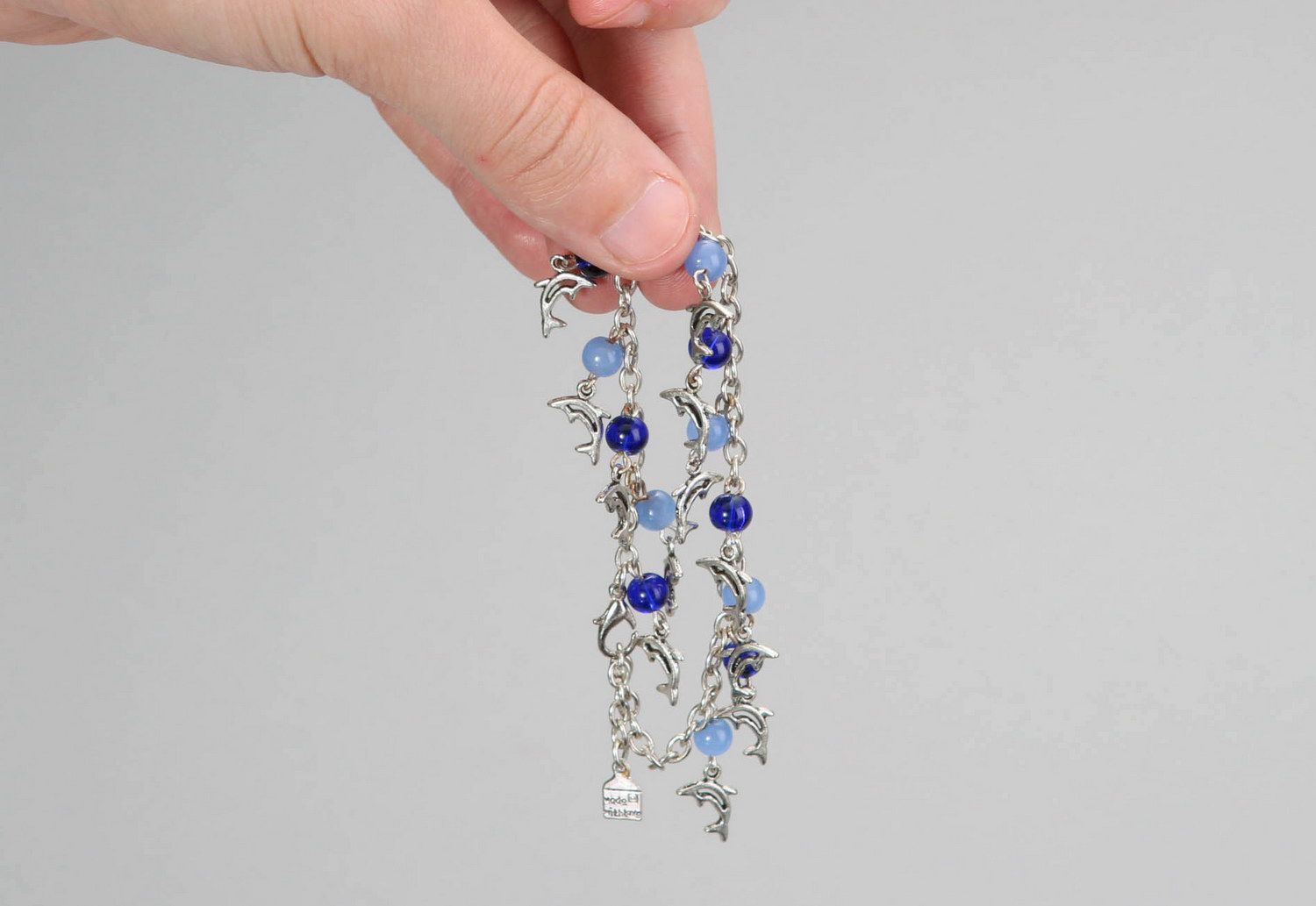 Bracelet avec pendentifs en verre et acier Dauphins  photo 3