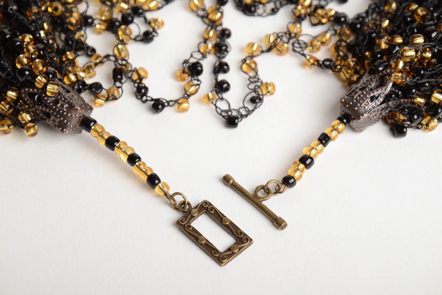 Handmade long massive necklace crocheted of black and golden Czech beads photo 3