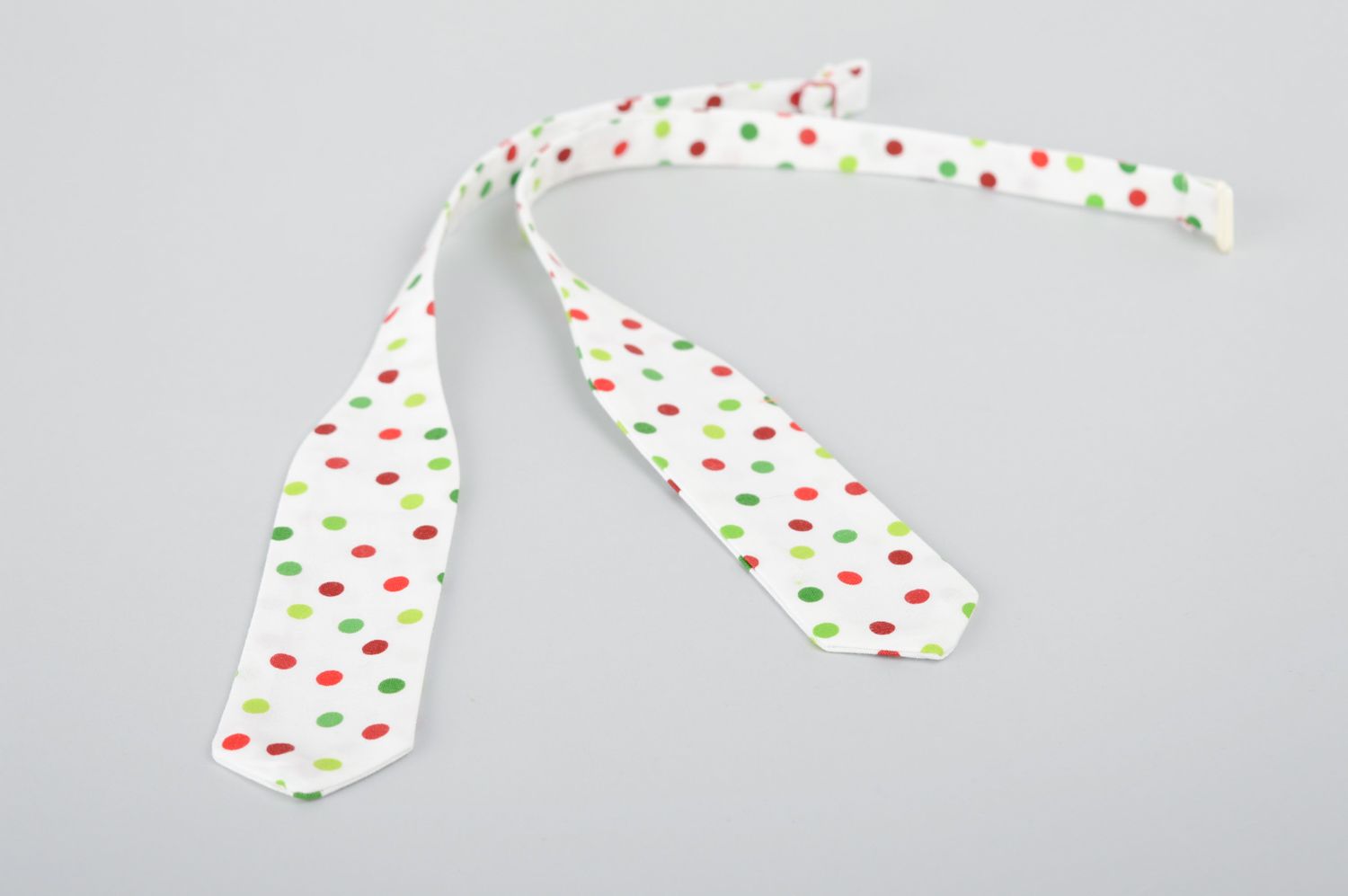 Handmade designer fabric bow tie of white color with polka dot print photo 2