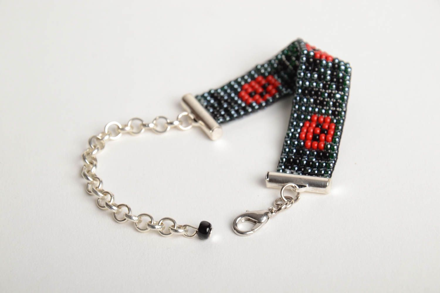 Black and red beads woven line wrist bracelet on a chain with poppies photo 4