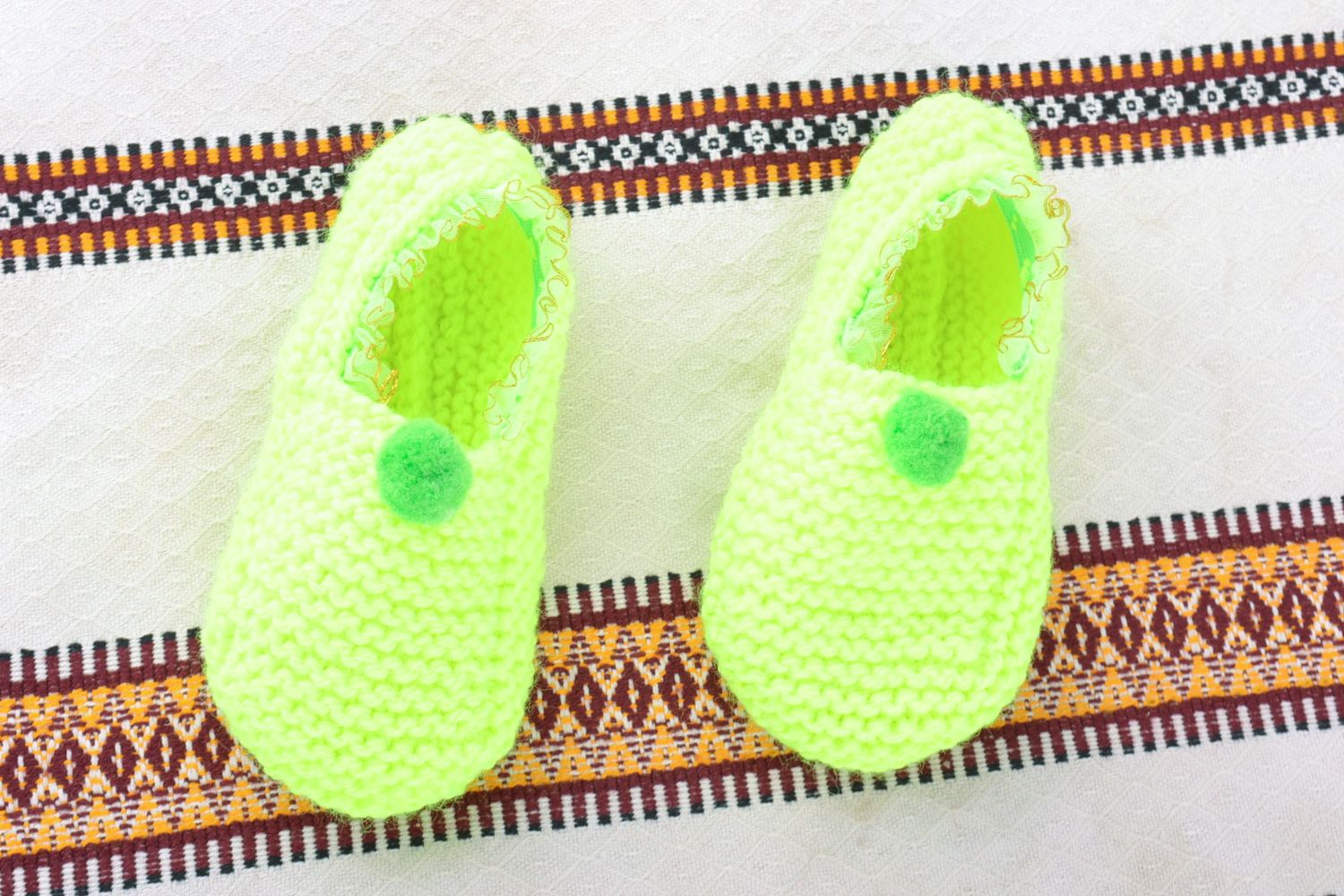 Beautiful light hand knitted wool slippers of lime color photo 1