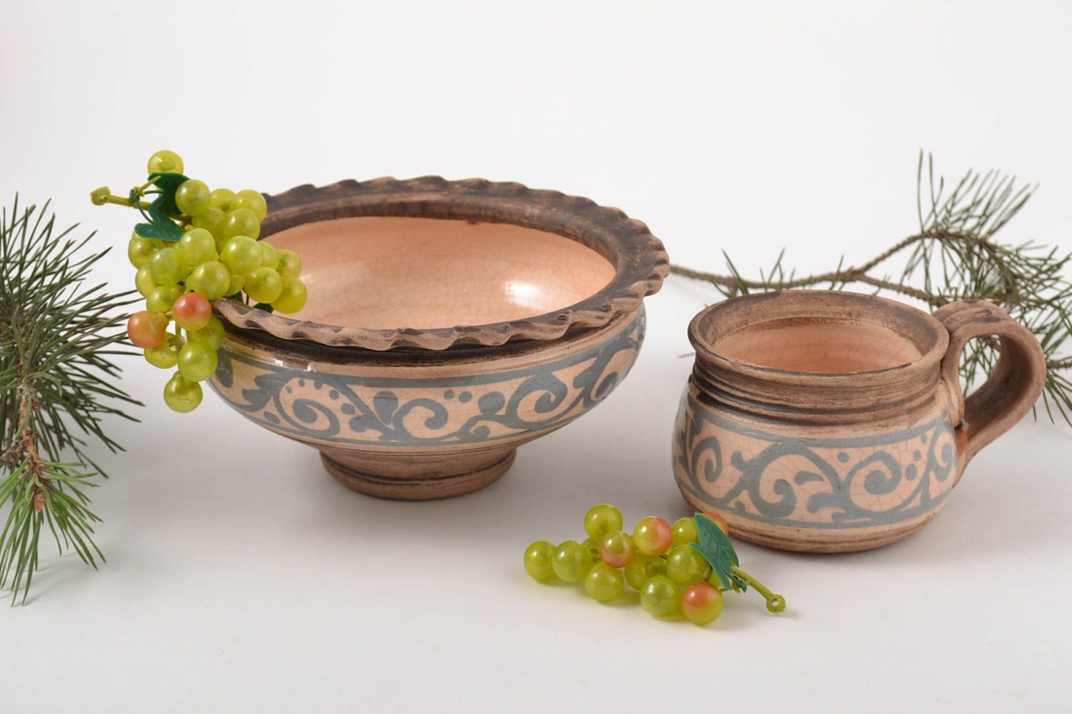 Decorative set of clay handmade pottery of the bowl and cup with rustic style pattern photo 1