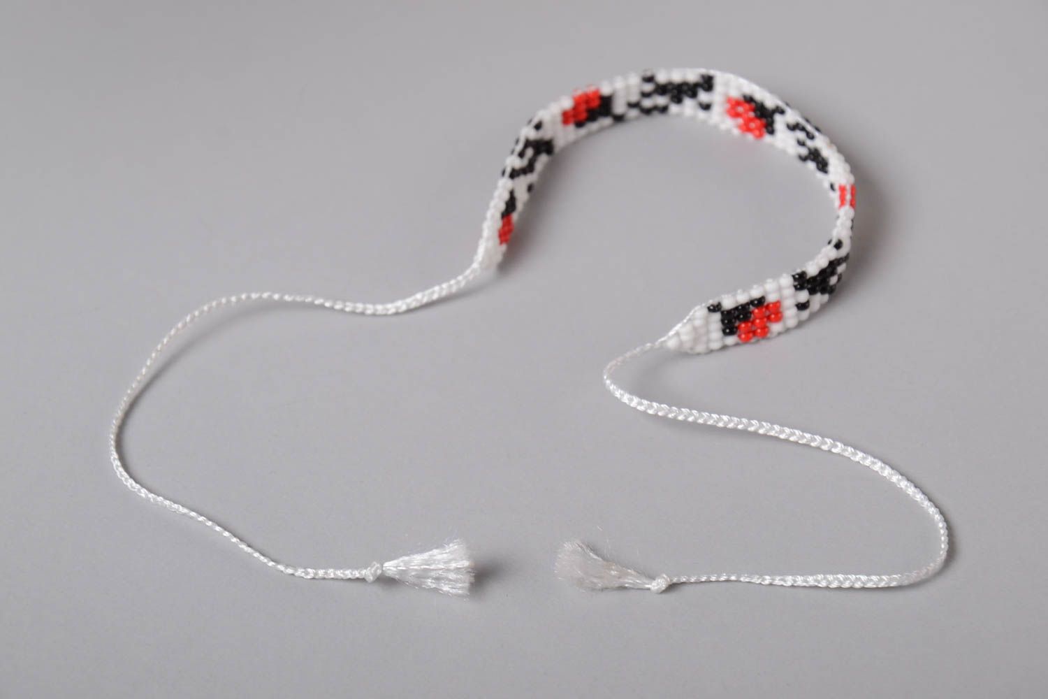 White, black, red, and green color beads strand bracelet on the white cord for teen girls photo 4