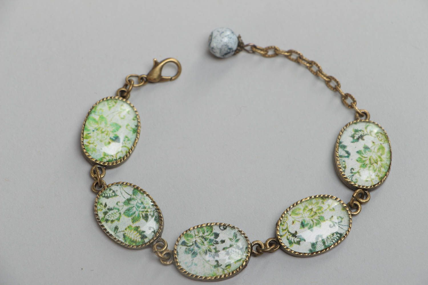 Handmade vintage bracelet made of glass glaze with metal fittings and pendants with green flowers photo 2