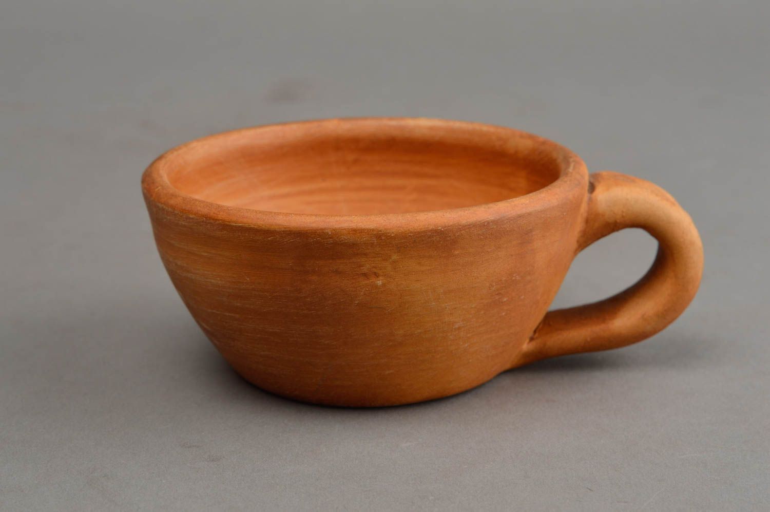 Low wide clay terracotta Mexican-style te cup molded of natural clay photo 2