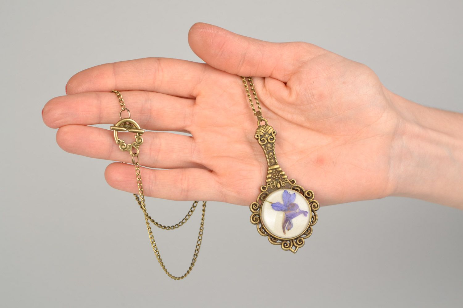 Handmade pendant pocket mirror on long chain with dried flowers coated with epoxy  photo 2