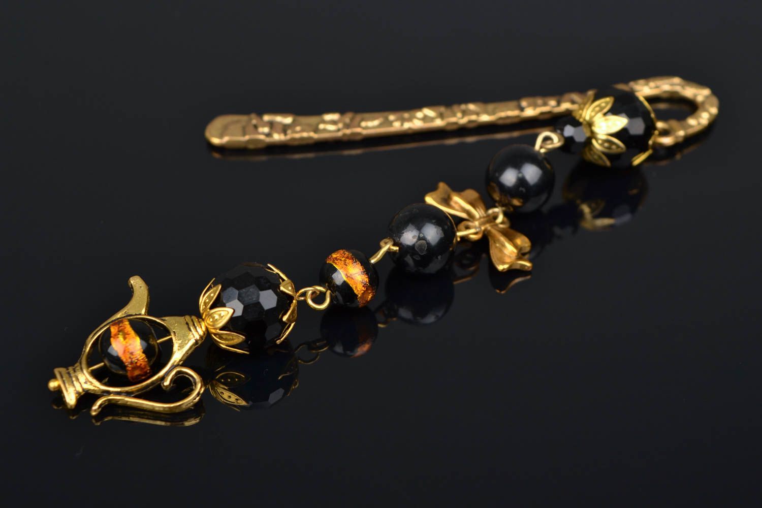 Golden-like bookmark with black beads photo 1