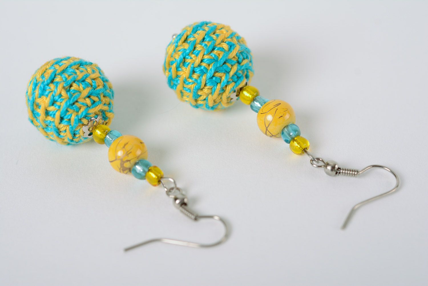 Handmade beaded earrings crocheted over with yellow and blue cotton threads photo 2
