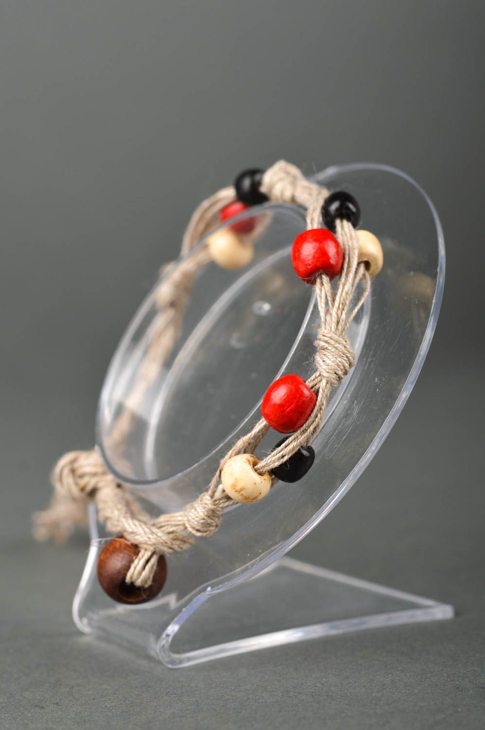 Strand beige rope two-row bracelet with red, black, white, yellow wooden beads for women photo 2