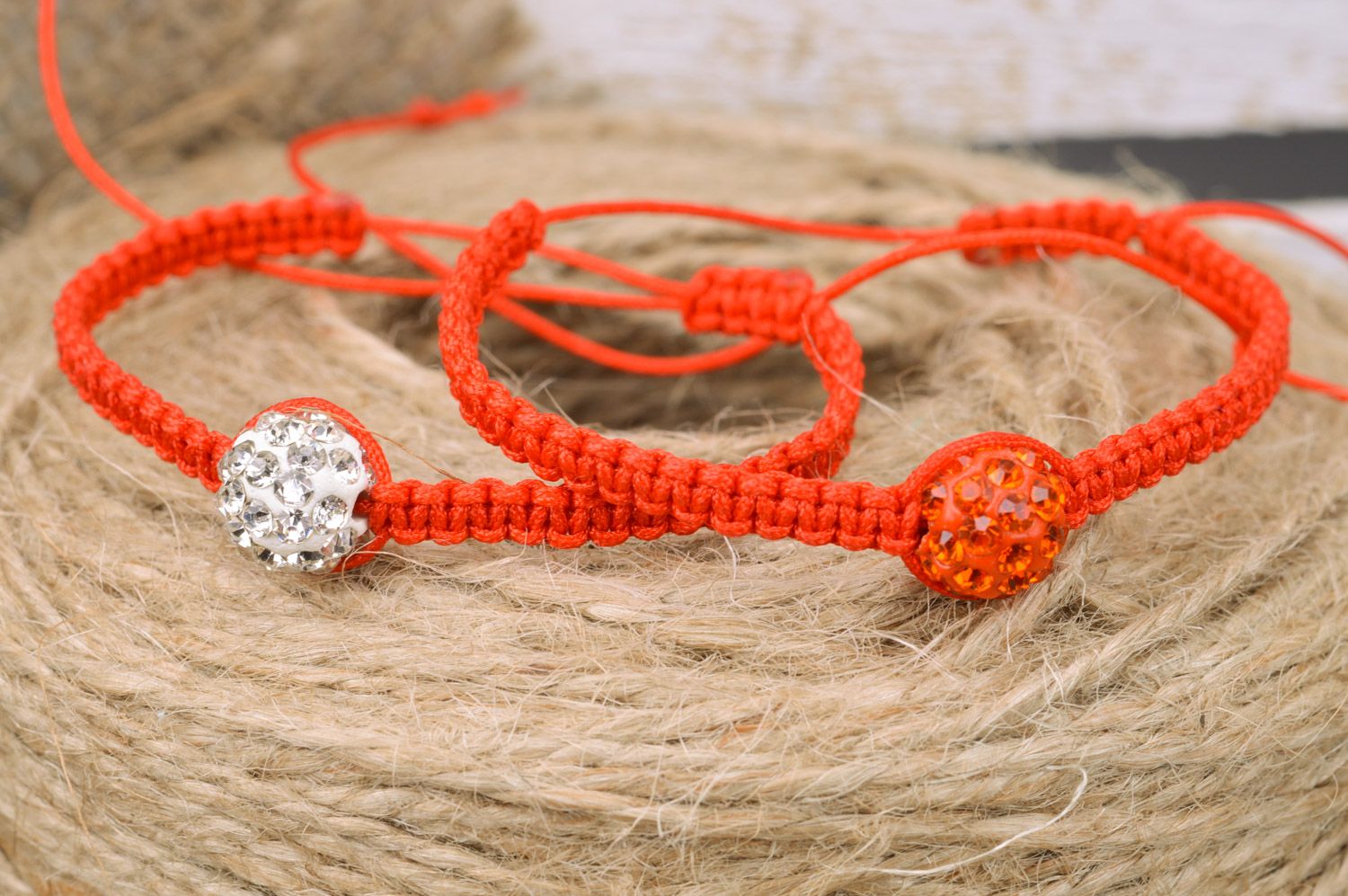 Set of 2 handmade orange friendship wrist bracelets woven of threads with beads  photo 1