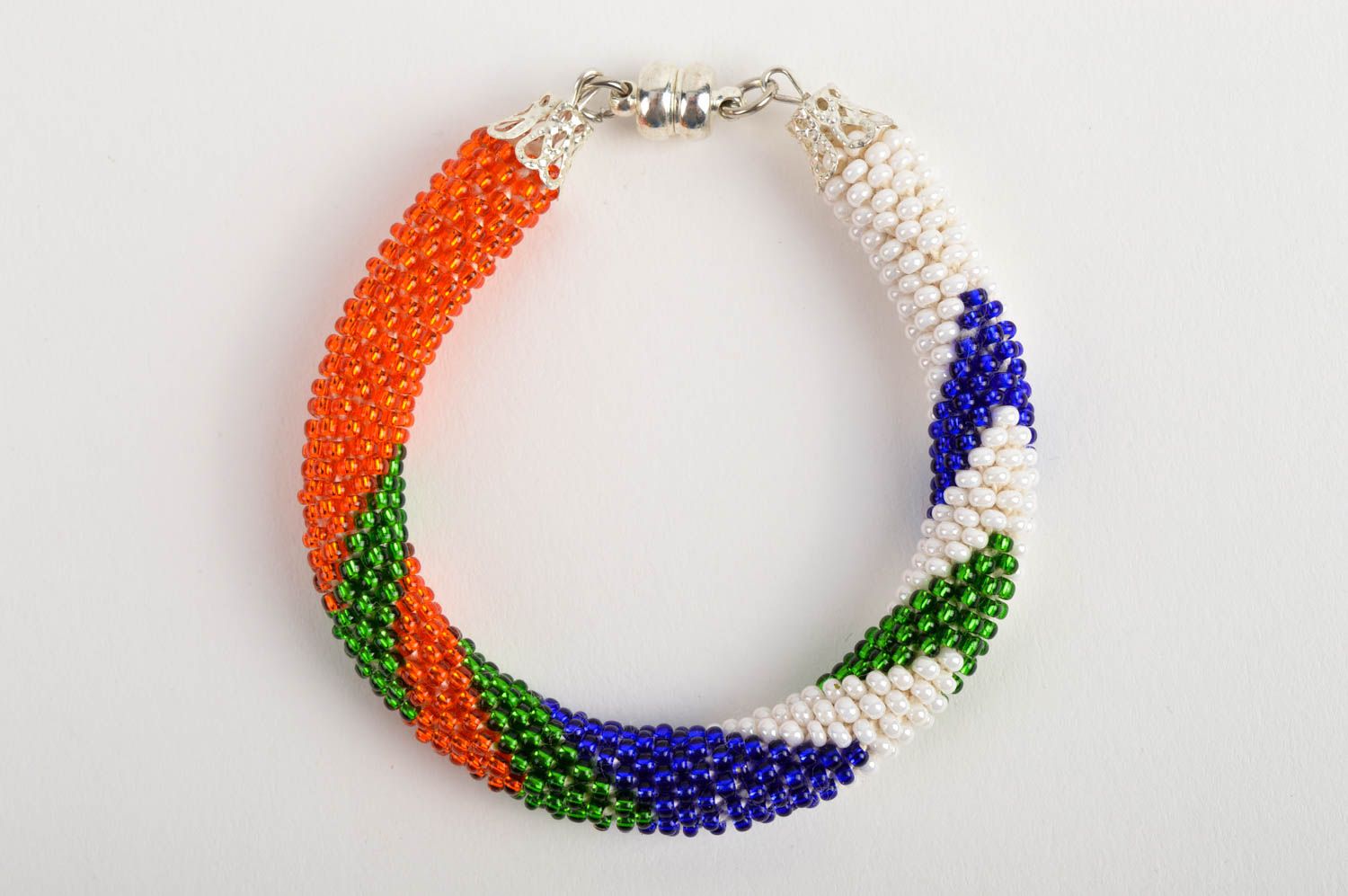 Bright handmade beaded bracelet in red, white, green, blue colors photo 2