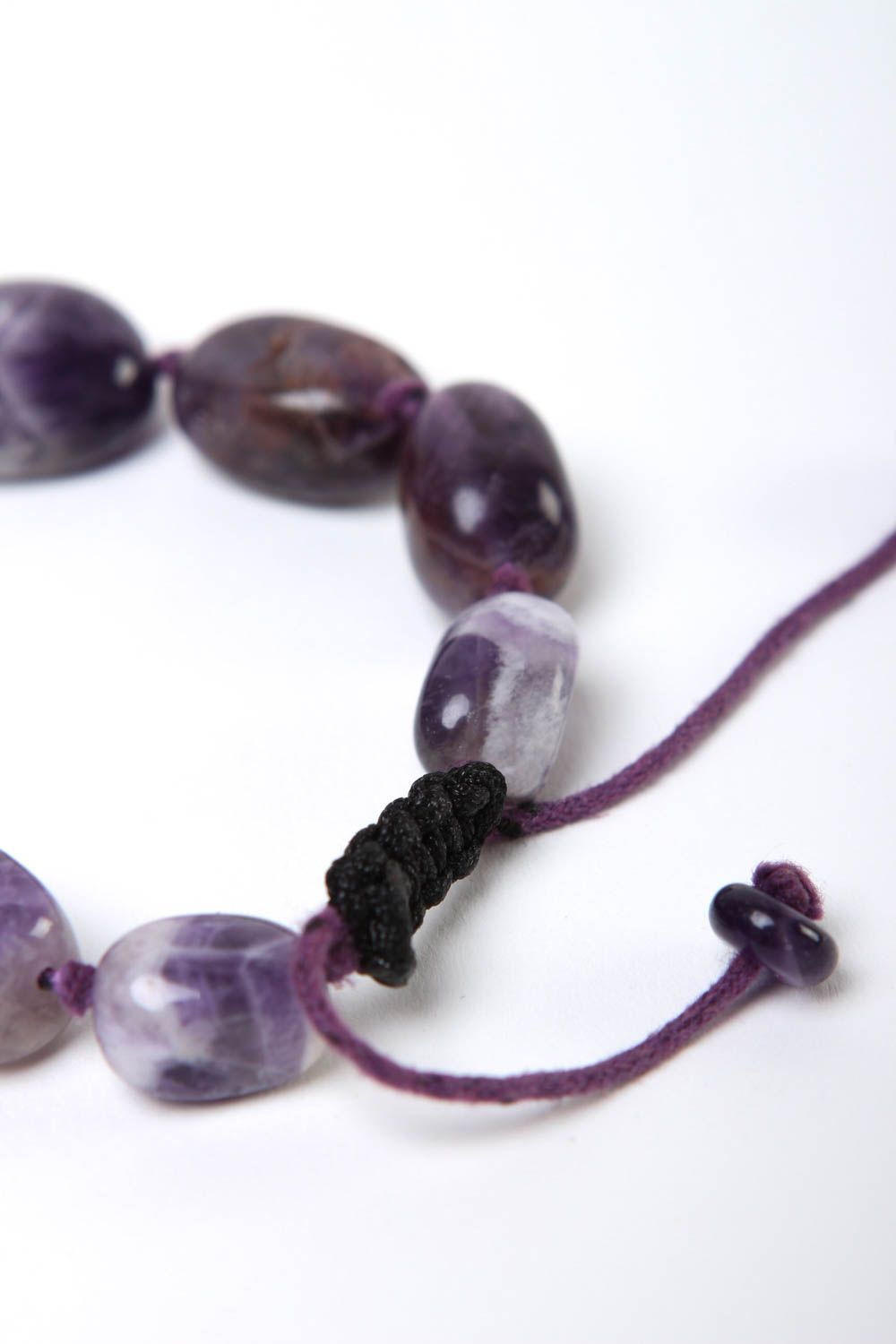 Strand bead gemstone bracelet with black cord and dark blue stone beads photo 4