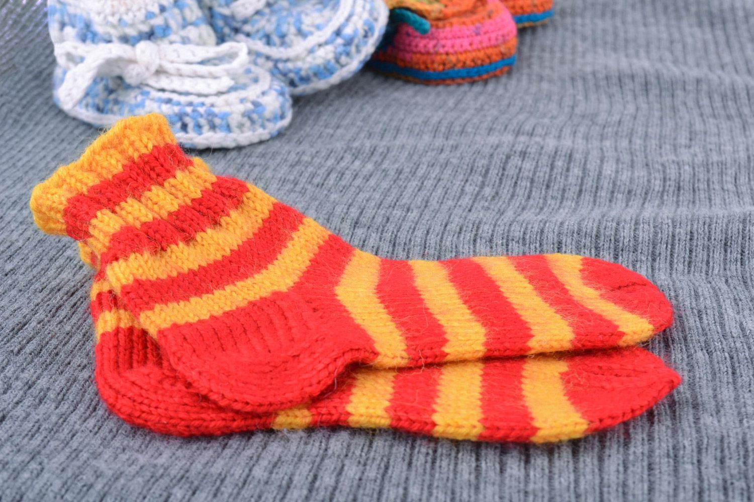 Yellow and red striped handmade baby socks knitted of semi-woolen threads photo 1