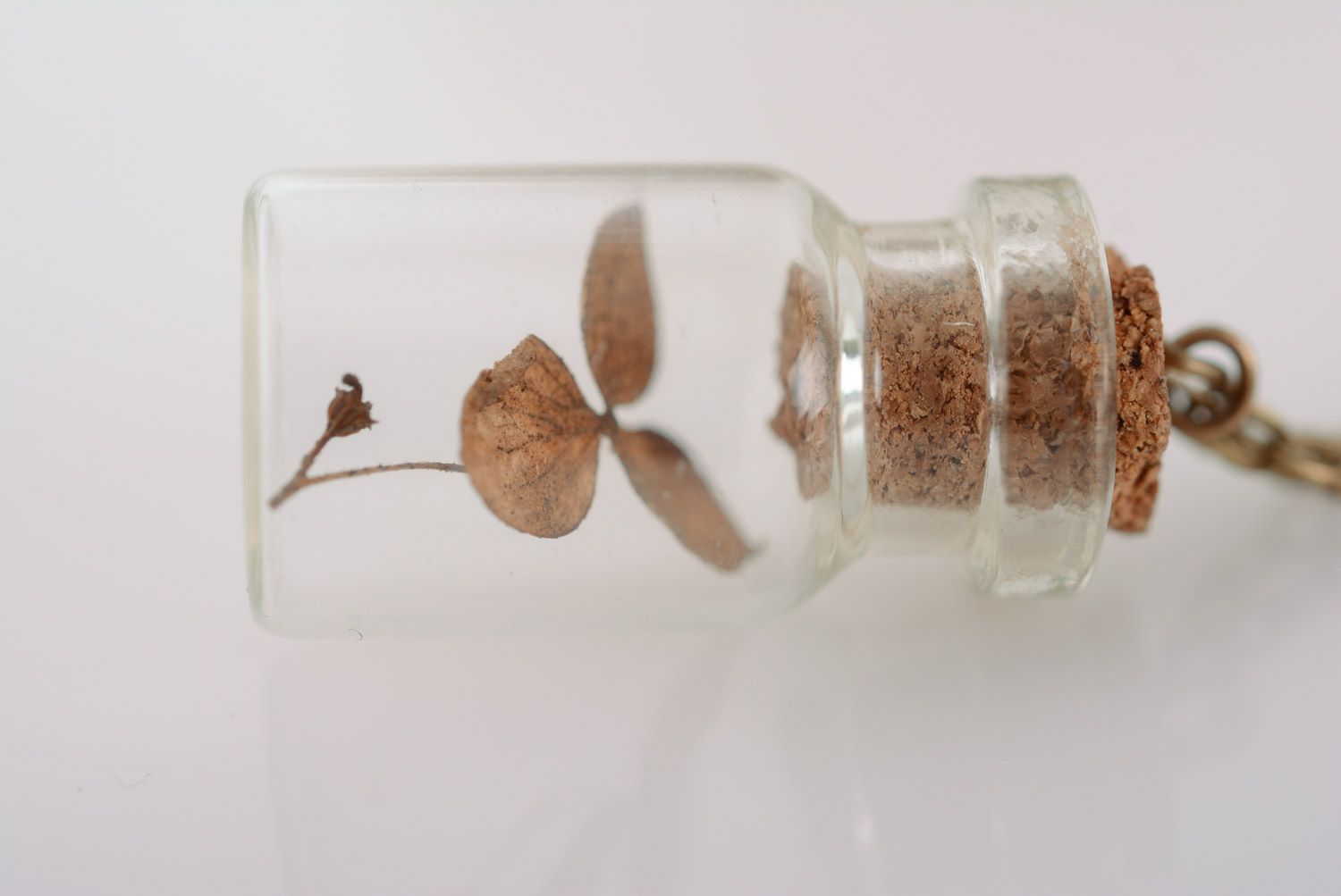 Small handmade glass vial with cork pendant with plant inside on metal chain photo 2