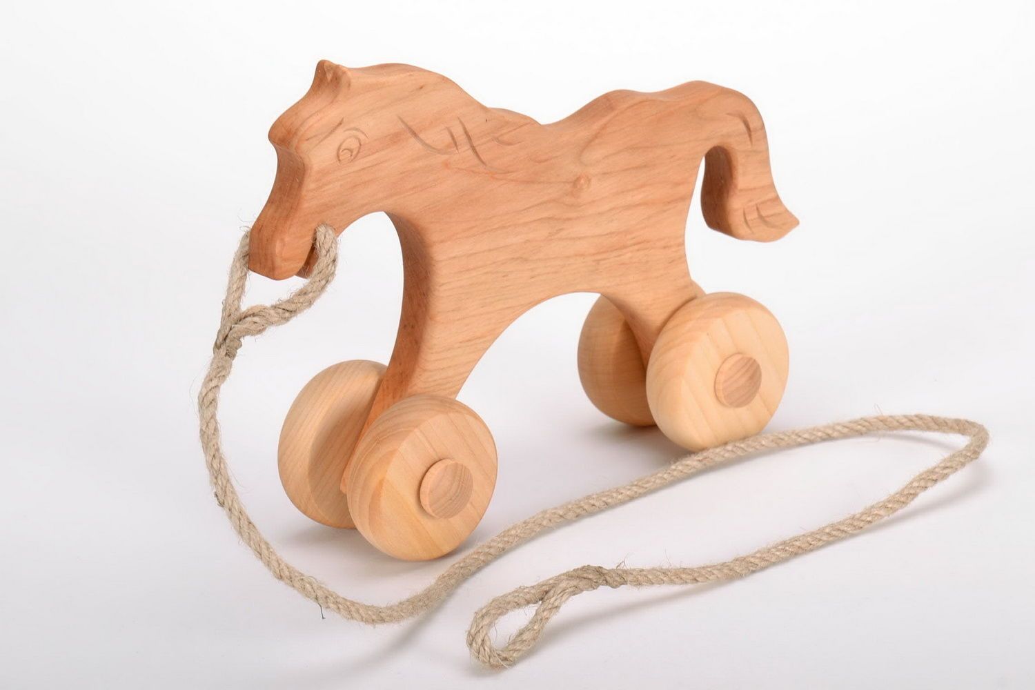Holzspielzeug Pferd mit Rädern foto 3