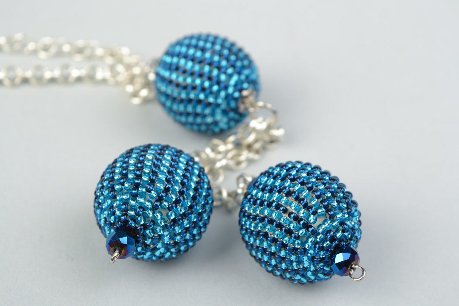 Laconic handmade pendant with blue beaded balls on long metal chain for women photo 3