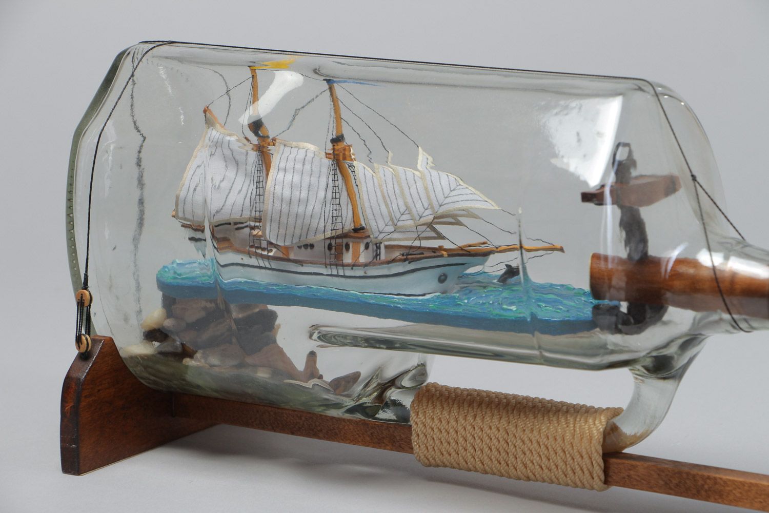 Handmade beautiful composition the ship in a glass bottle in marine style photo 4