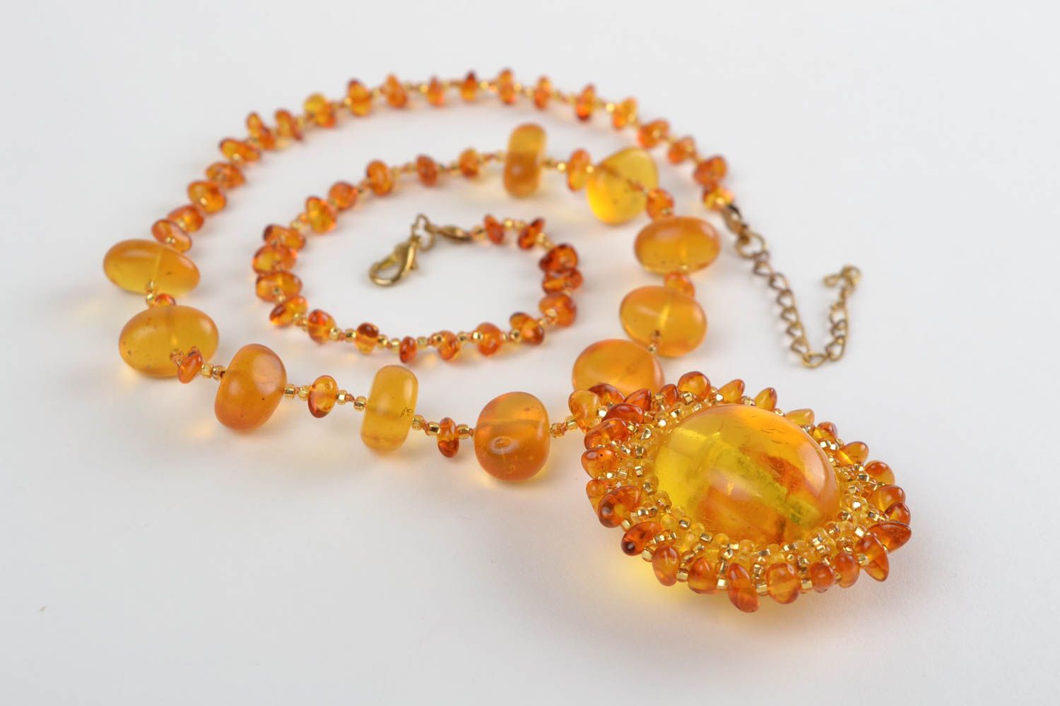 Handmade cute long pendant made of beads and natural stones of amber color photo 2