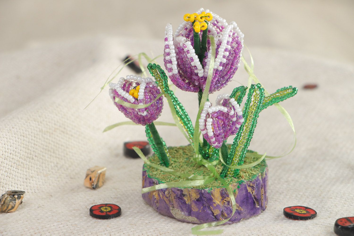 Round holder with hand woven beaded flowers in the shape of crocuses photo 1