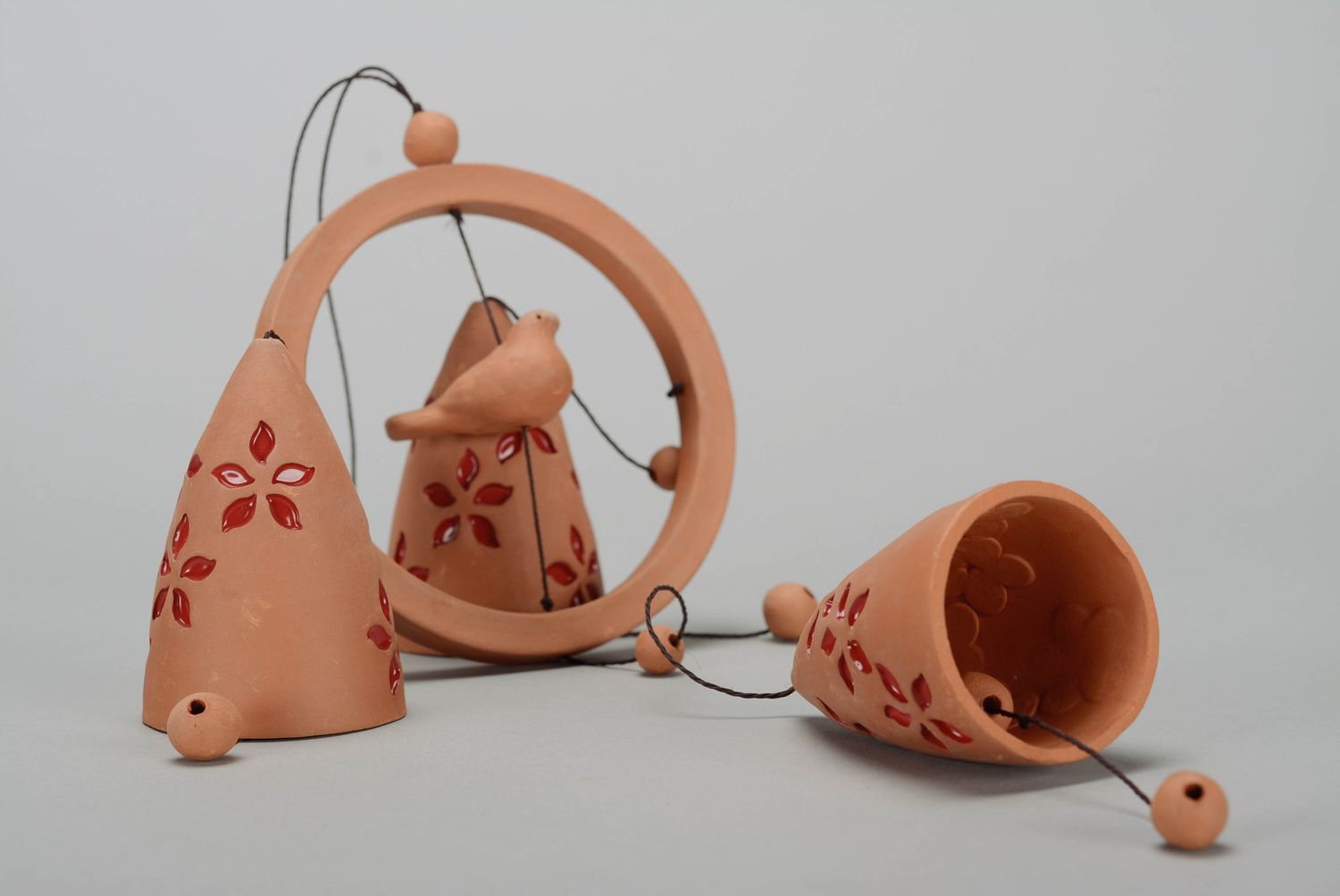 Clay bells with red flowers photo 1