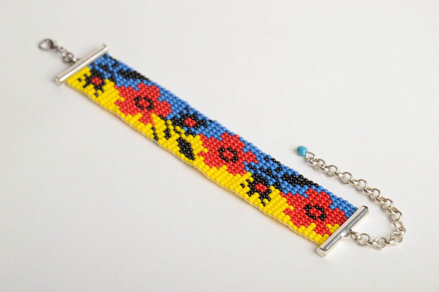 Handmade blue and yellow bead woven wrist bracelet with red poppy pattern  photo 5