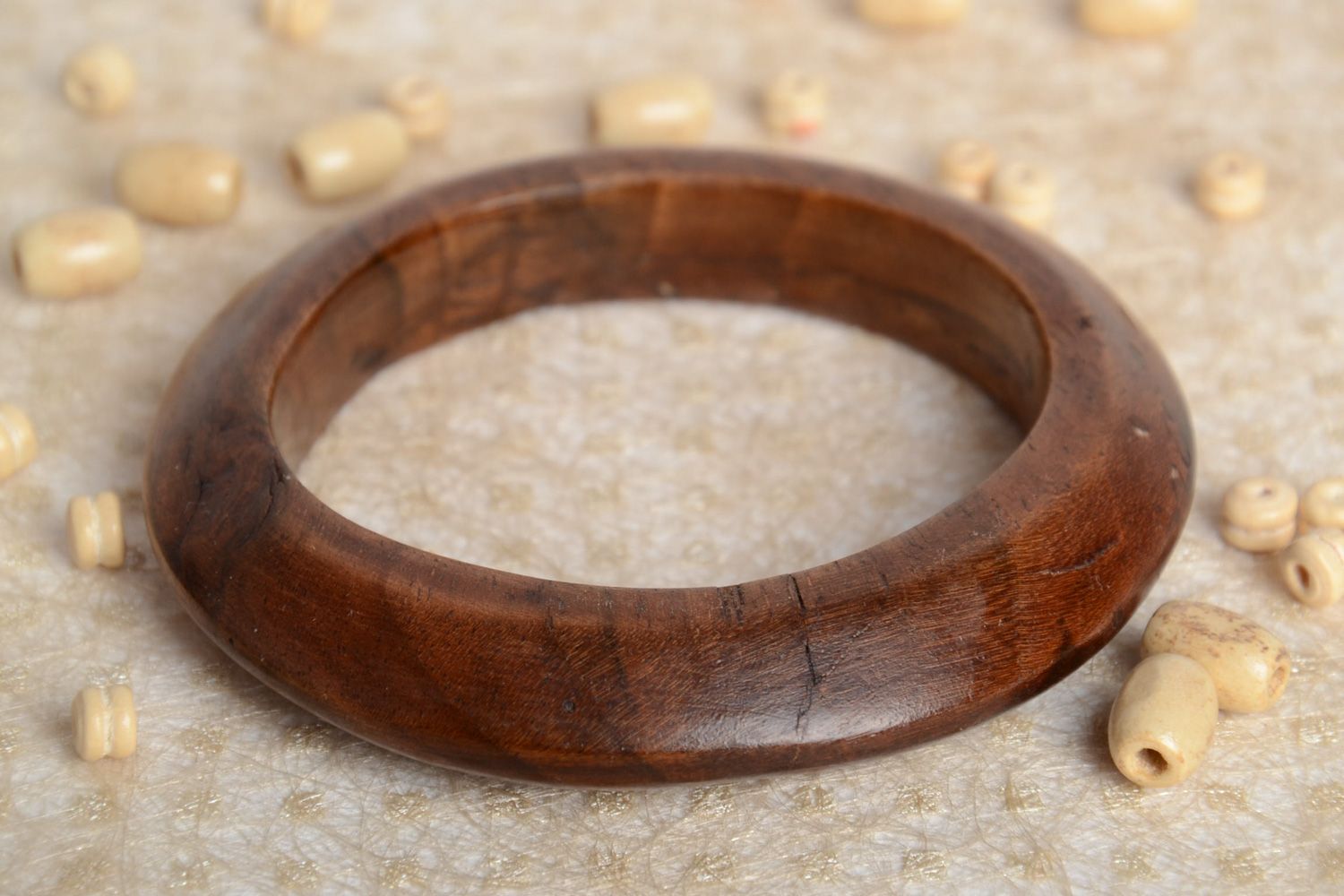 Elegant thin handmade wrist bracelet carved of wood and varnished for women photo 1