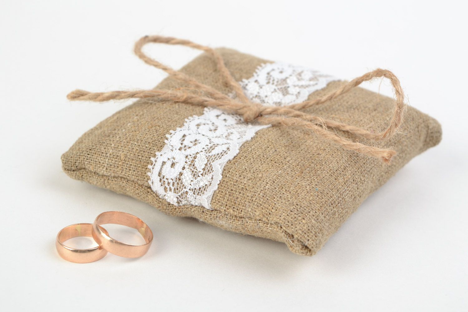 Handmade ethnic rings bearer pillow sewn of burlap with white lace and cord  photo 3