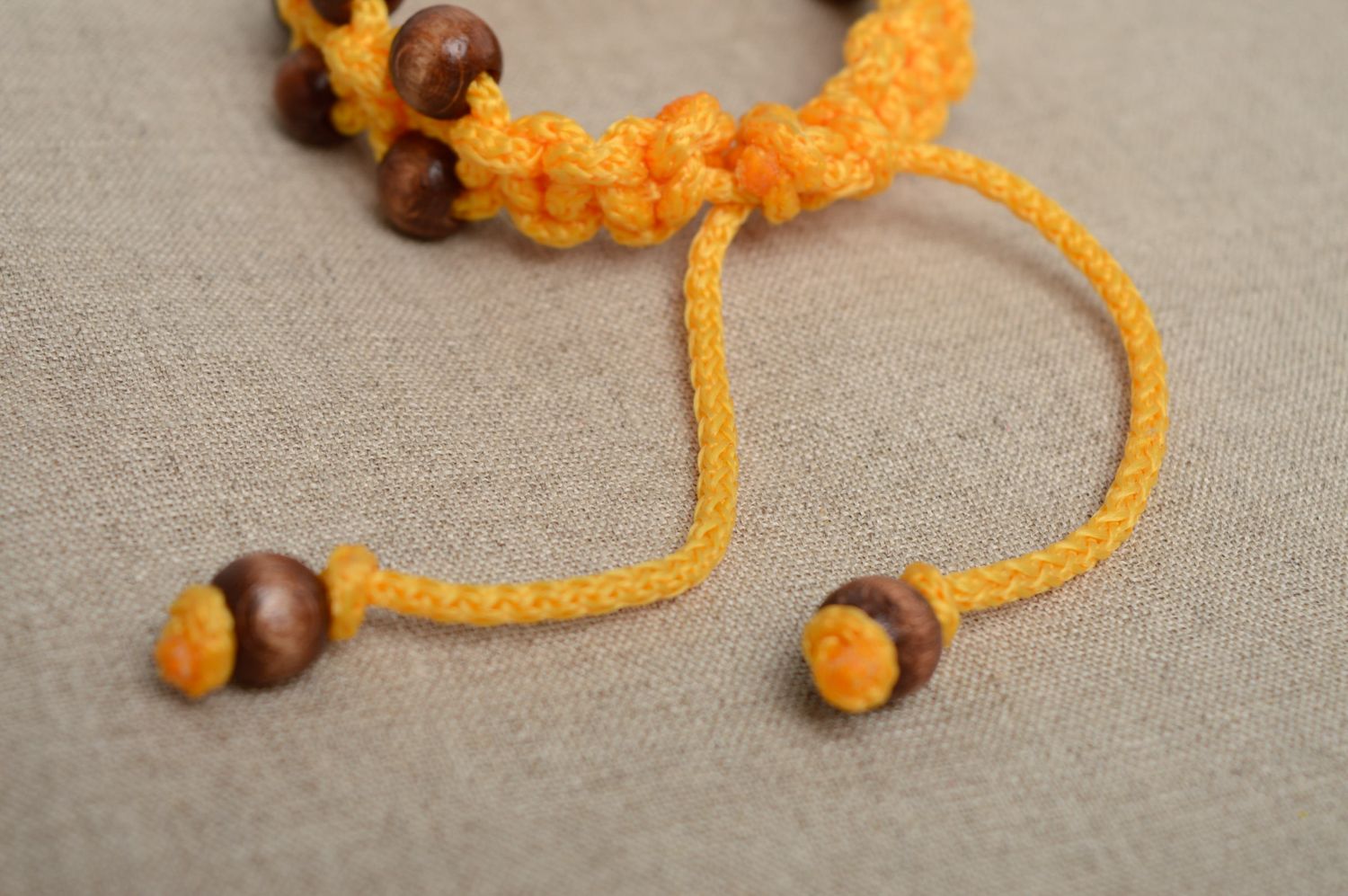 Macrame polyester cord bracelet of yellow color with wooden beads photo 4