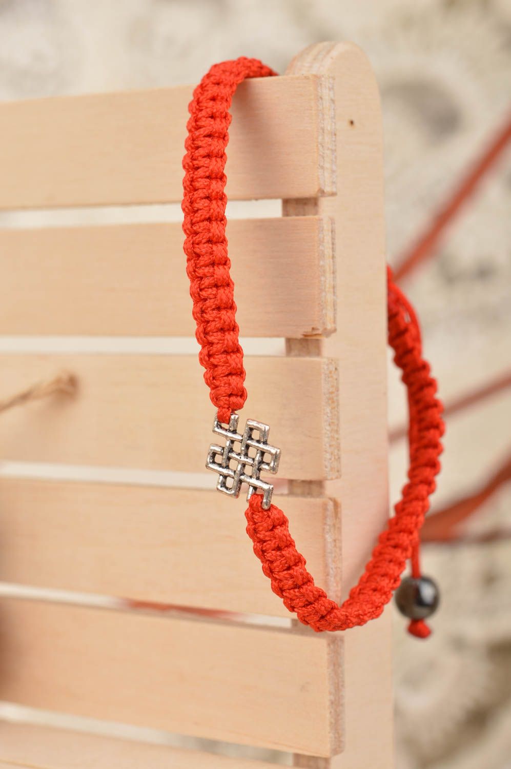 Handmade designer woven red silk friendship bracelet with metal insert photo 1