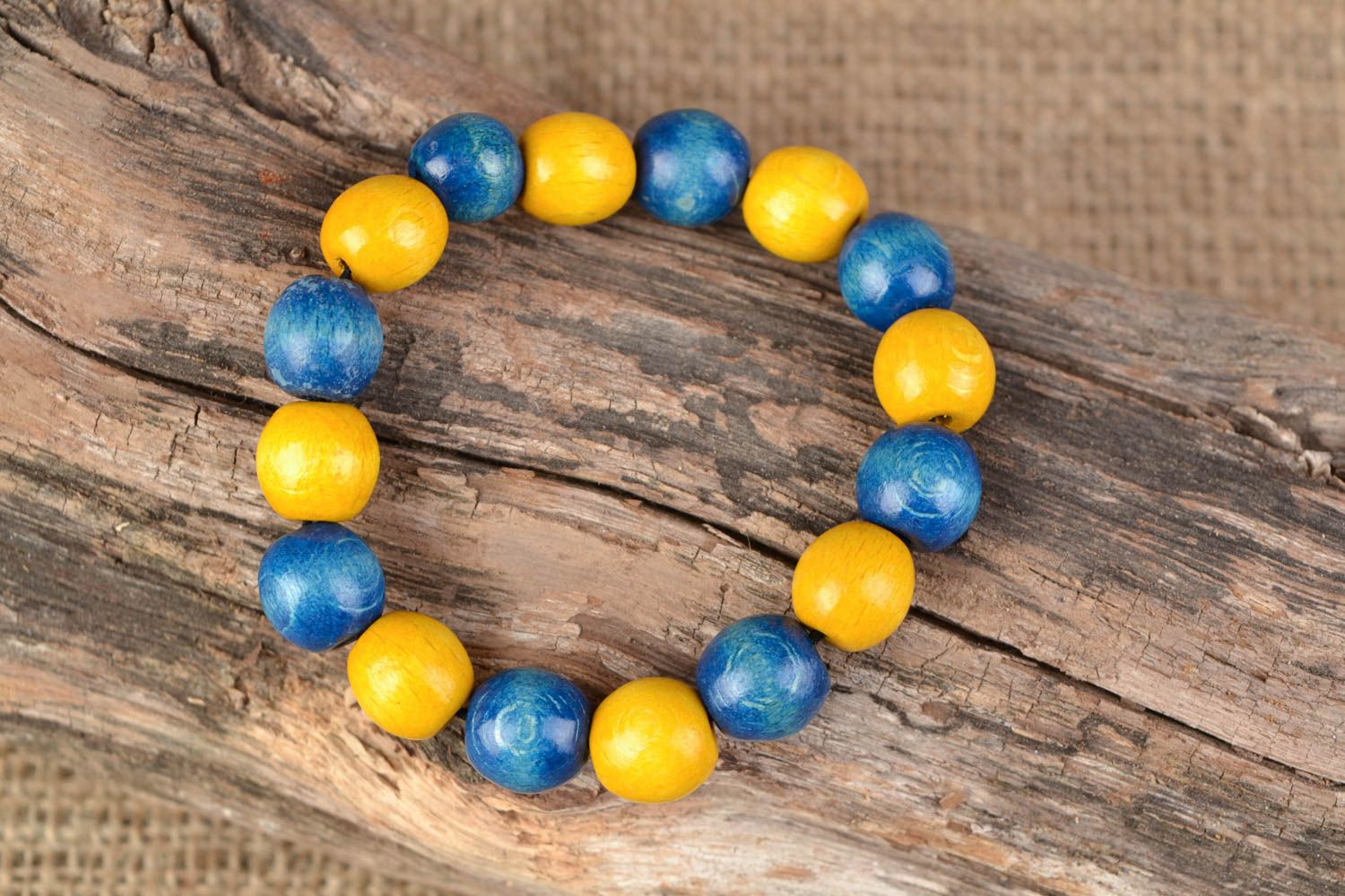 Yellow and blue handmade wooden bracelet photo 2