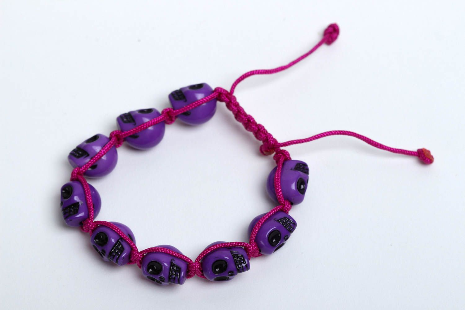 Purple strand skull beads bracelet on red cord for young girls photo 2
