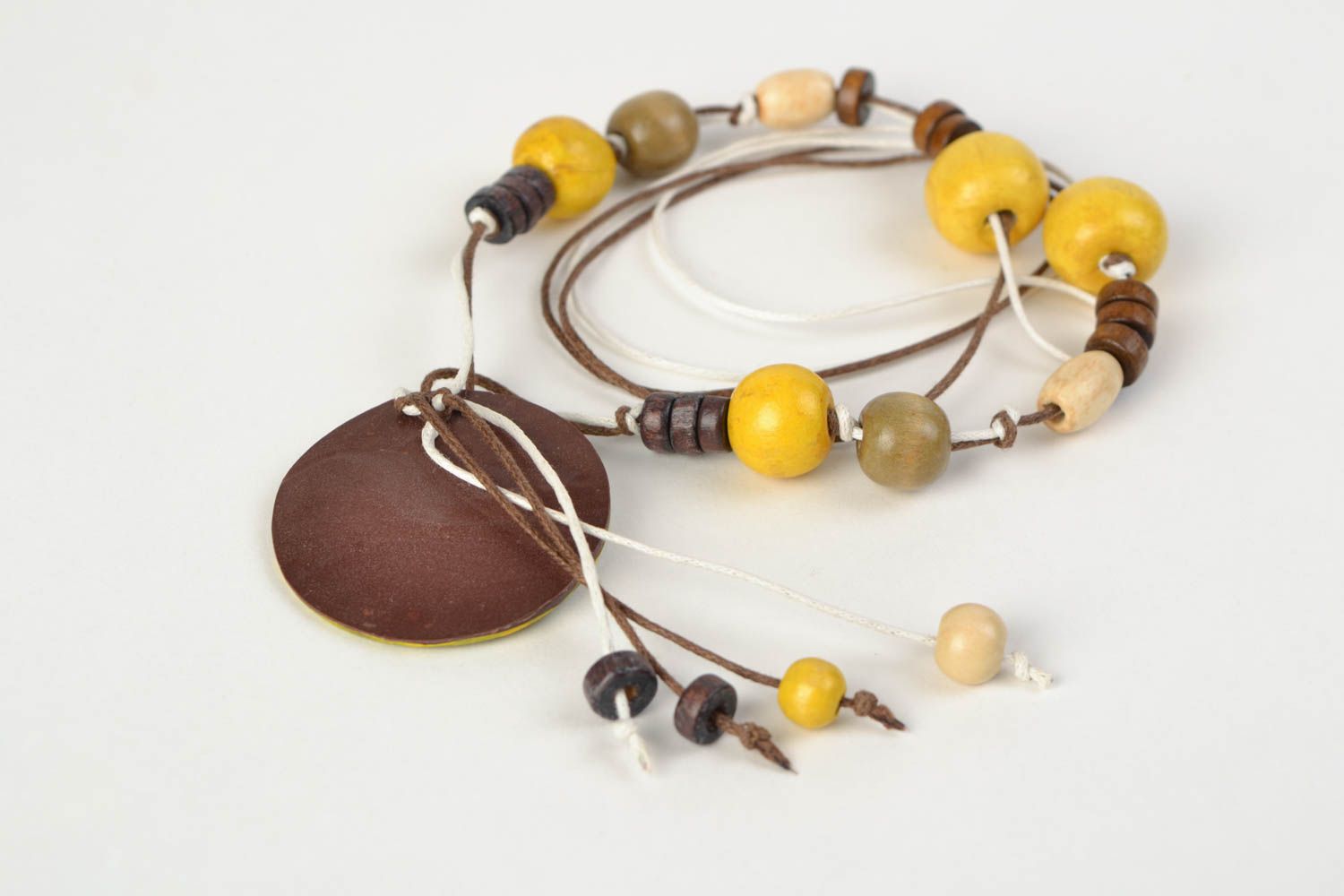 Handmade ethnic yellow and black polymer clay neck pendant on a cord with beads  photo 5