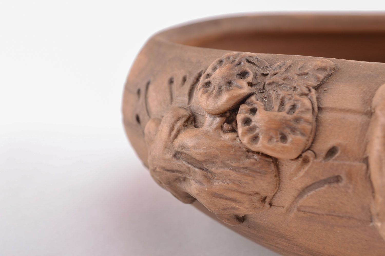 Clay bowl with molded decorative elements photo 3