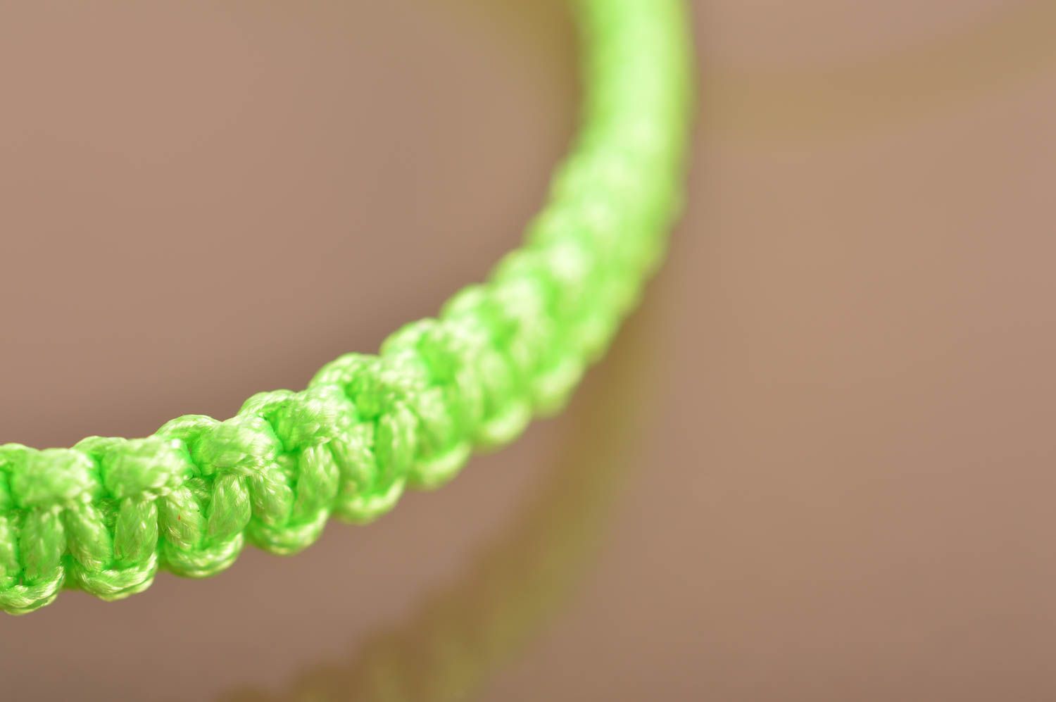 Beautiful handmade woven silk thread bracelet of lime color with metal charm photo 4