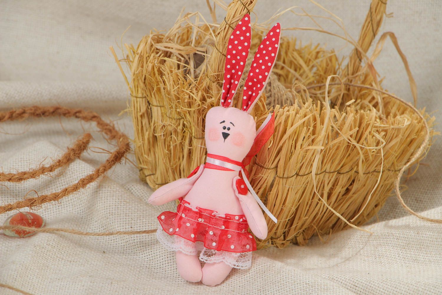 Handmade small cotton fabric soft toy pink rabbit in red skirt for children photo 1