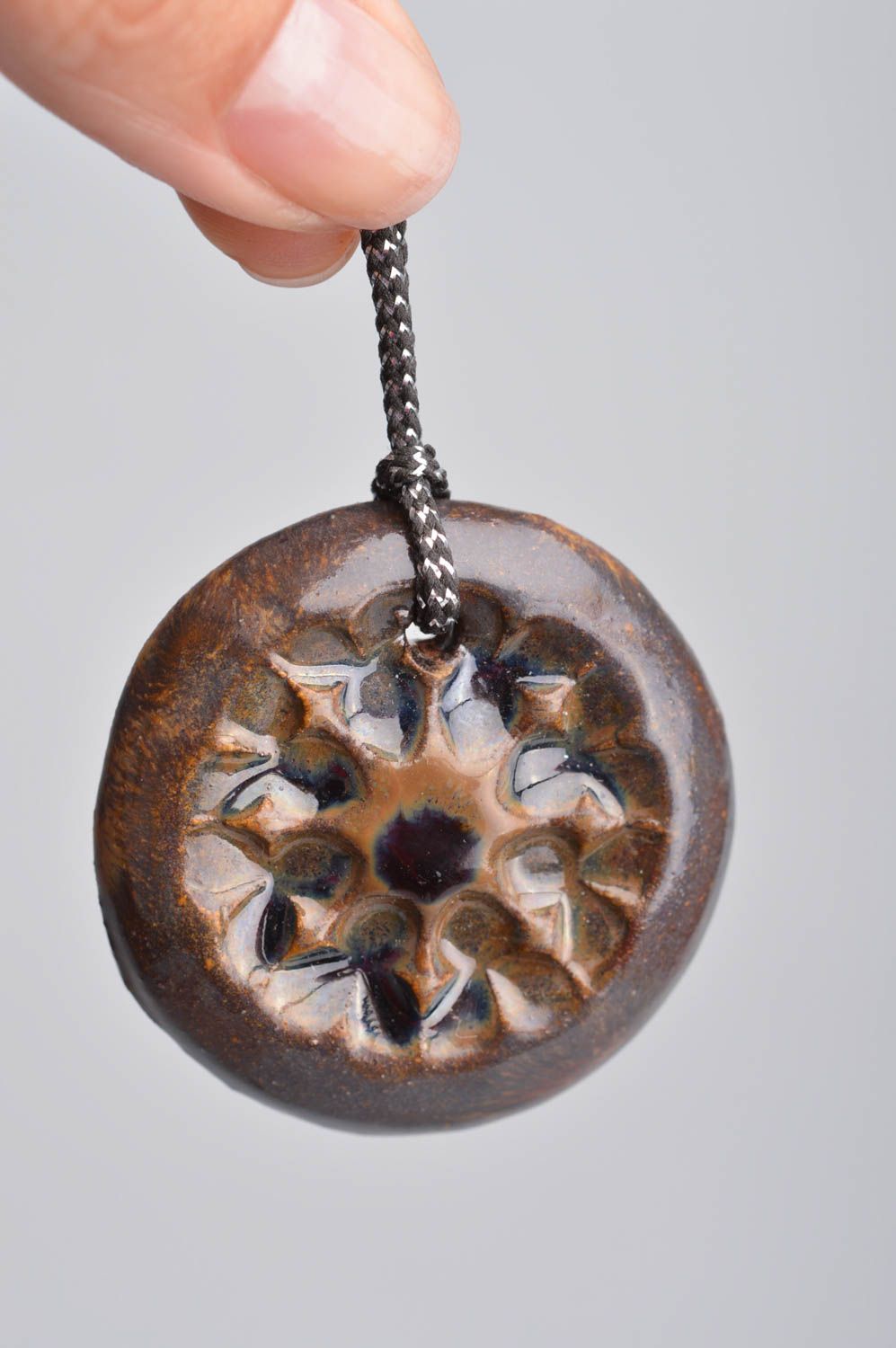 Round unusual cute handmade brown beautiful pendant made of clay on lace photo 3