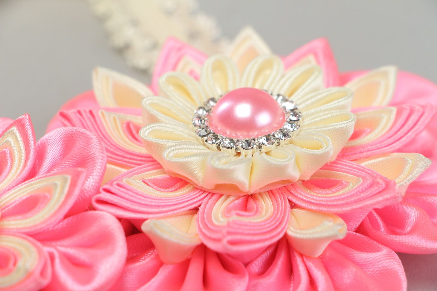 Handmade designer headband with satin ribbon flower in pink and cream colors photo 3