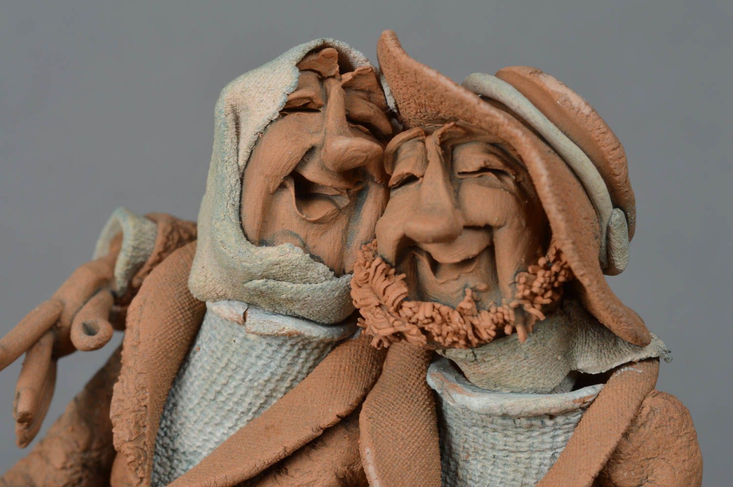 Handmade decorative unusual clay sculpture Cheerful couple in a boat photo 3