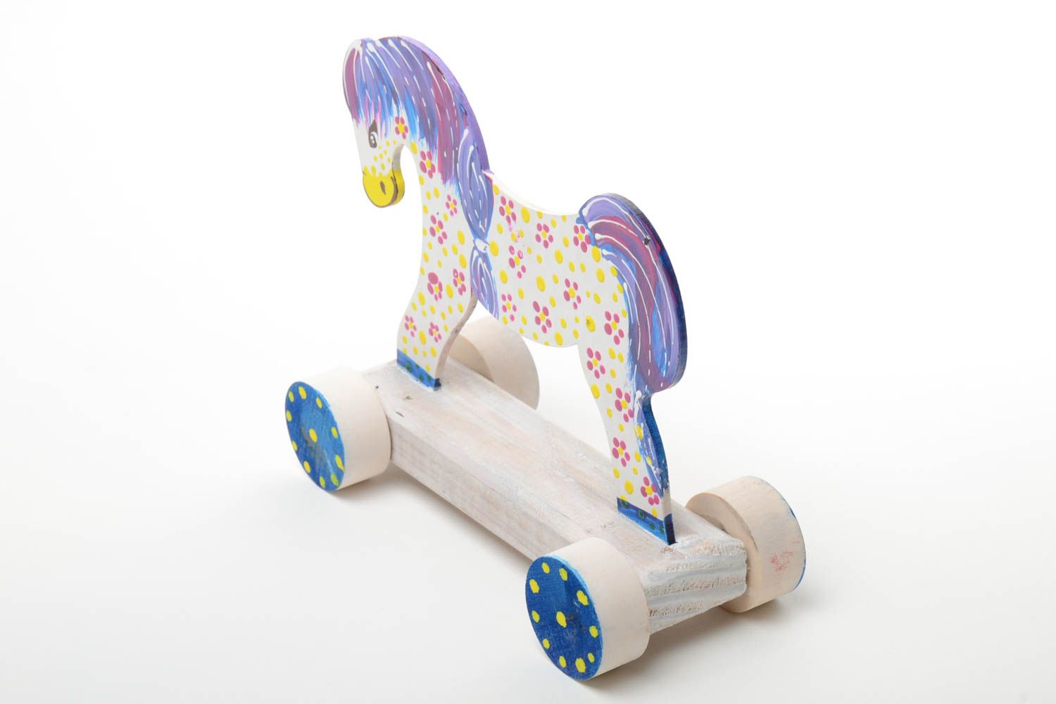 Bright painted handmade wooden wheeled toy of light color Horse for children photo 2