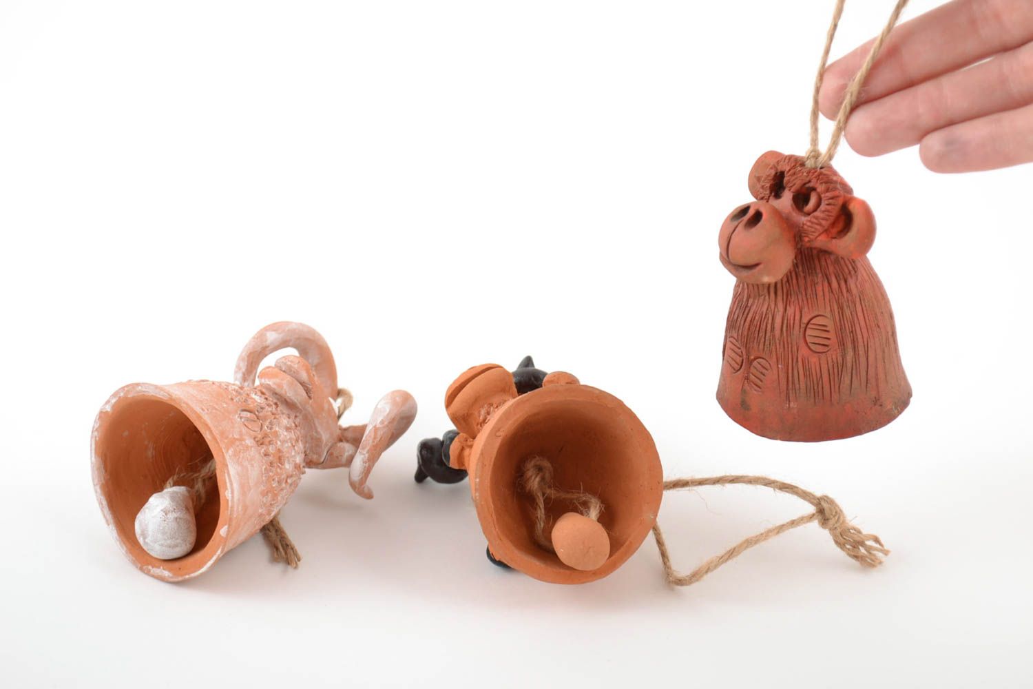 Set of funny handmade ceramic painted figured bells in the shape of animals photo 2